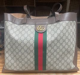 Gucci Ophidia Large Tote Bag, crafted in GG Supreme canvas with brown leather trim