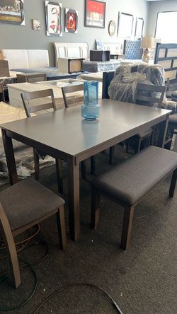 Ashley grey dining set 6pc new. Boxed was $899 in stock Perris Menifee Oceanside ontario $500 firm can finance n layaway Zelle Cash App credit trades.