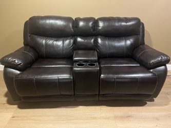 2 brown leather sofas