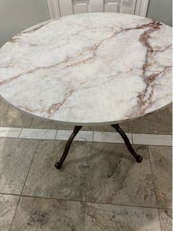 Metal and real marble round dinning table The top of the Marble is New