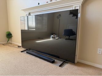 Samsung 85 inch 4K TV with soundbar and bass boost