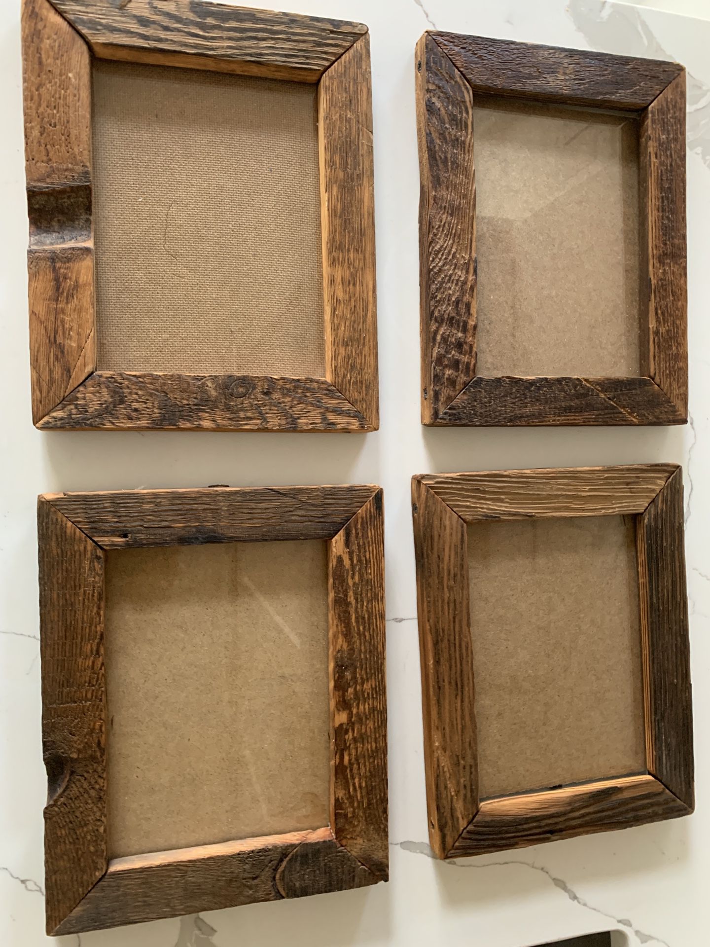 Four rustic 9 x 11” picture frames.