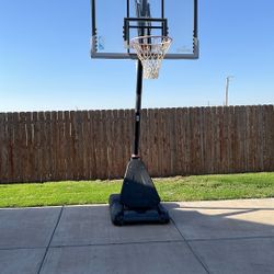 Nice Basketball Goal. Bought At The  Academy. Red Rope At Bottom Is Just To Hold It Down. We Just Don’t Need Academy. Has Sm Crack In Side Bottom Plas