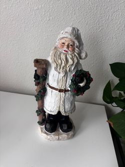 A rustic resin ceramic figurine Santa Claus