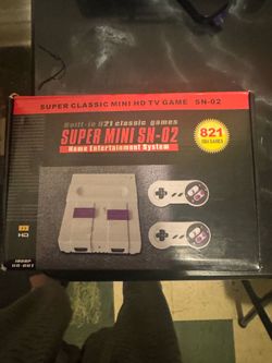 Super mini  sn -02 with a 821 games 8 bit games
