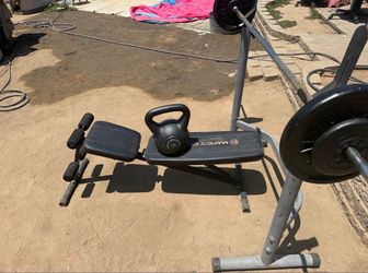 BENCH PRESS GEAR with 65 lbs, 35 lbs kettlebell, and jump rope.