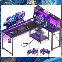L- Shaped 53" Gaming Desk With Storage Shelf, LED Lights And Built In Charging Station. New, Unassembled In Box. 