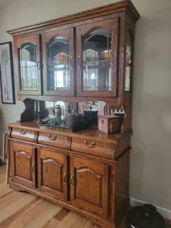 Oak China cabinet and huge table with 8 chairs. , great condition