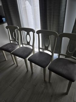 Round white dining table and chairs