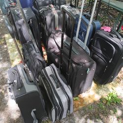 LOTS OF NICE PULL ALONG LUGGAGE 