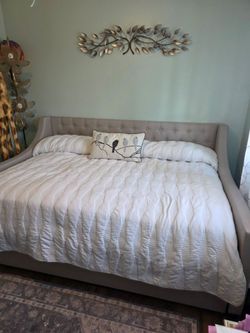 Upholstered Daybed with Tufted Backrest