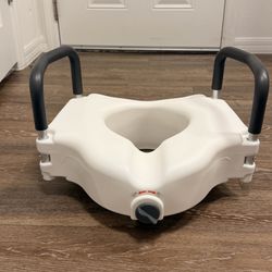 Raised toilet seat