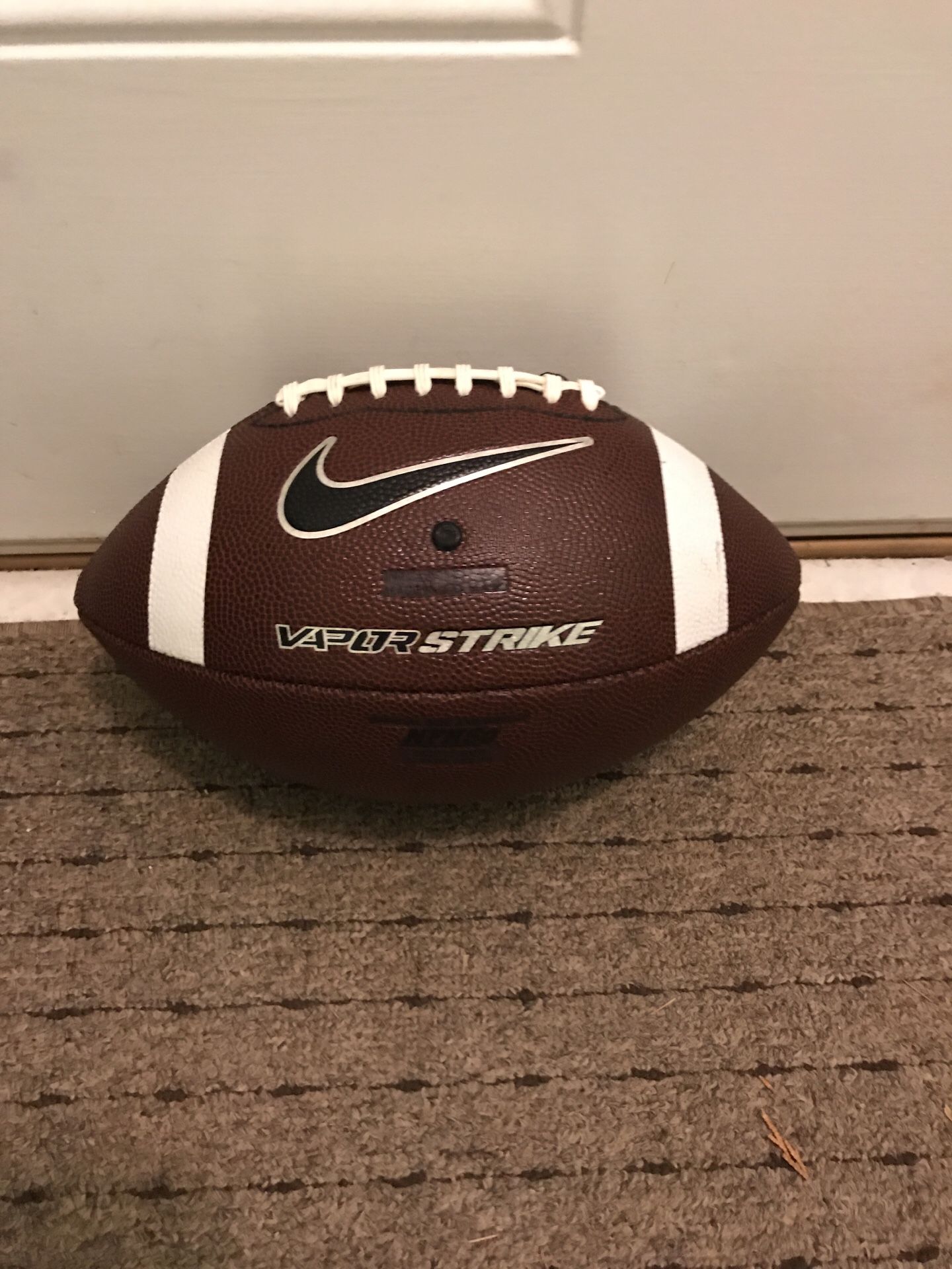 Bran new Nike vapor strike football.