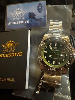 Brand new still wrapped diver watch, with membership card,manual, hard shell case and watch still sealed.