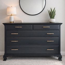 Beautiful black dresser with a timeless, elevated look. Finished in a deep matte black and accented with sleek gold hardware. This piece has a classic