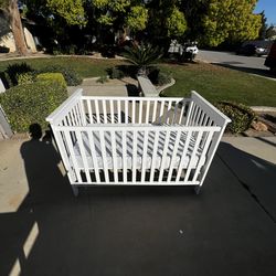 Baby crib with mattress