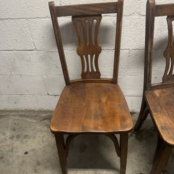 pair of antique wooden dining chairs 