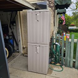2 Rubbermaid storage cabinets w shelves, has locks but no keys, not waterproof, gd for garage or under patio awning