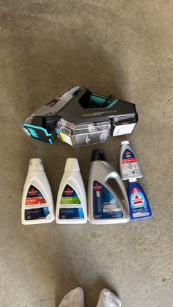 Carpet shampooer +  cleaning supplies