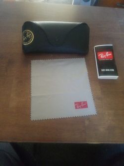 Ray-Ban black textured leather case with booklet and cleaning cloth.