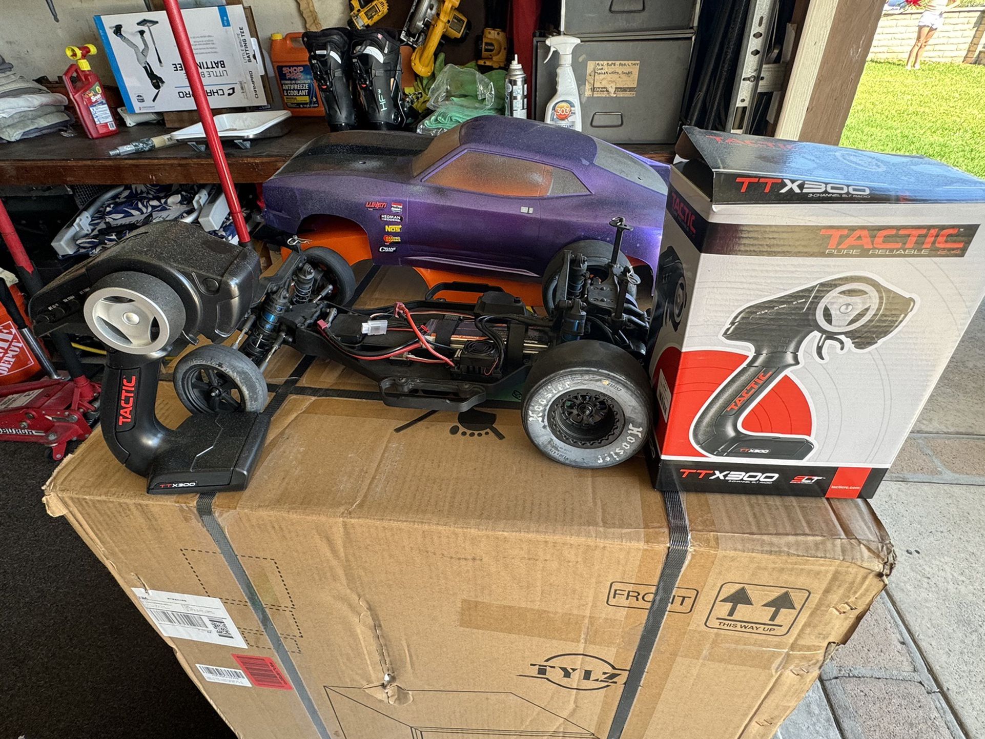 RC 10 Car and Bodies , 2 Controllers  One Never Used.  2 Bodies Fit.  2 are from Other Cars.  See Pictures.  Purple Orange Bodies Fit Chassis.  125$