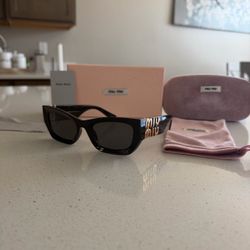 Miu Miu thicker sunglasses