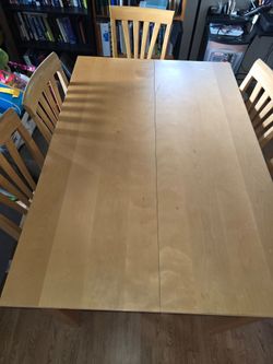 Table and 6 chairs with leaflet