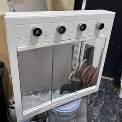   LIGHTED TRI-VIEW MEDICINE CABINET