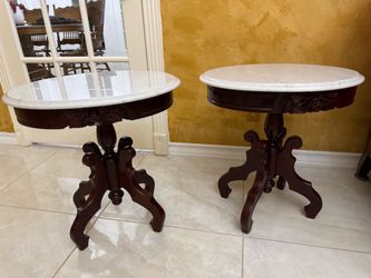 This Victorian Empire-style side table features a white marble top.