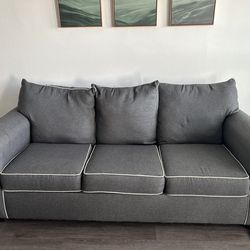 Grey couch with white trim