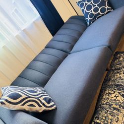 Stylish Blue Modern Sofa with Geometric Pillows – Perfect for Cozy Living Spaces