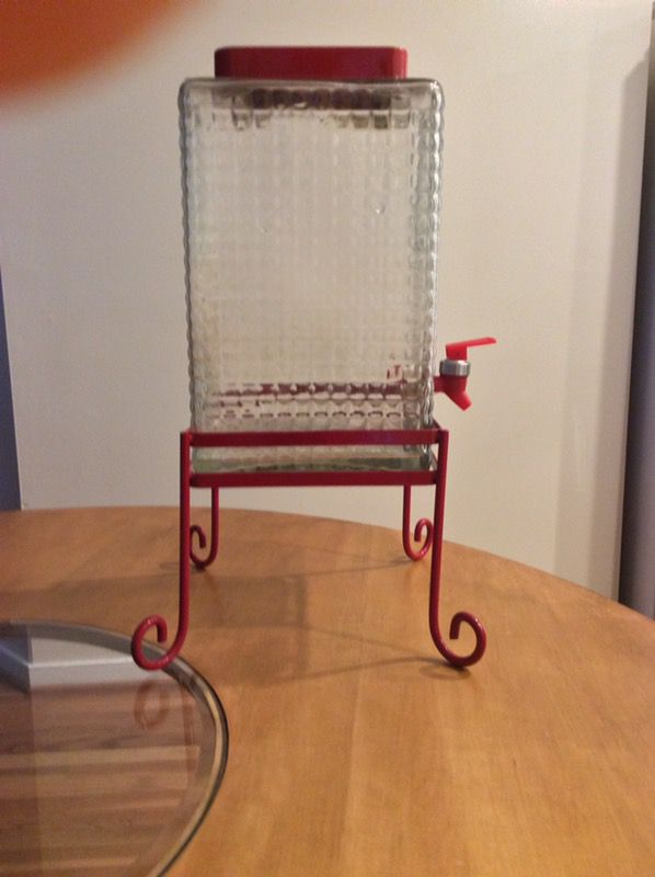 Glass beverage dispenser with stand