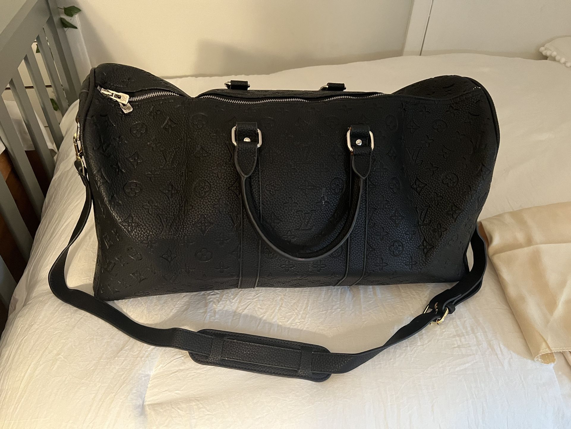 Louis Vuitton 55 Embossed Monogram Keepall Duffle bag