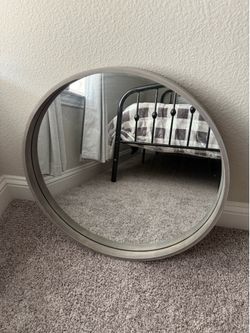 Gray circular wall mirror