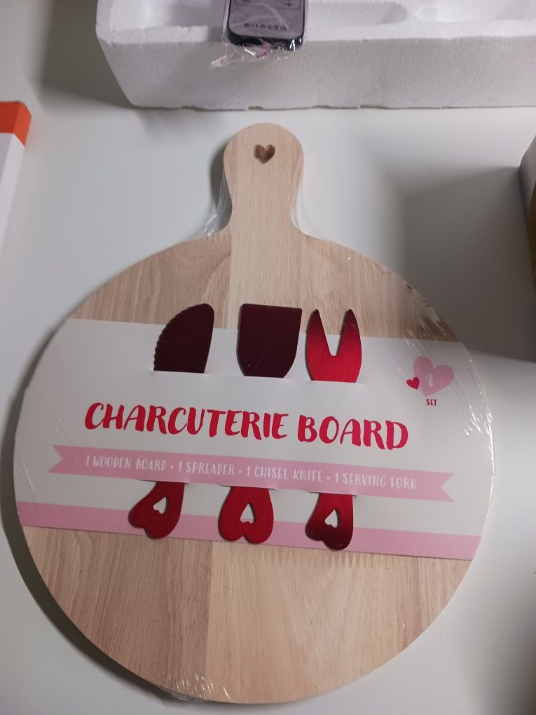 Charcuterie board with special cheese utensils New and sealed.
Only 5 dollars (on sale for 20 dollars).
Incredible deal 