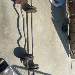 Two Exercise Bars With Some Weights 