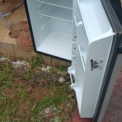 Mini Fridge/And Small Freezer Section. 