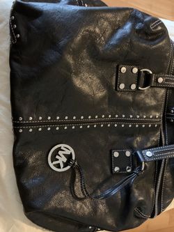MK black tote with silver stud accents.