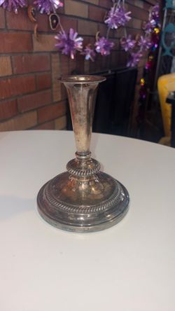 Vintage trumpet-style silver-plated candlestick featuring an elegant flared stem