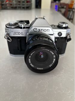 Canon AE-1 , 35mm film  Camera  w/ Case , tested , in perfect condition .