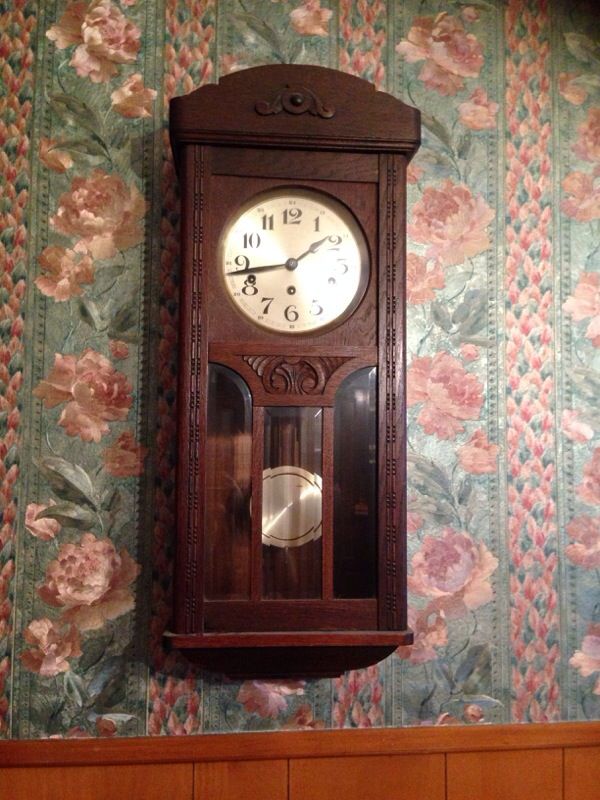 Old antique clock with original key