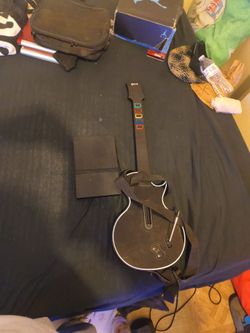 PlayStation 2 and a PlayStation 3 Gibson guitar hero wireless