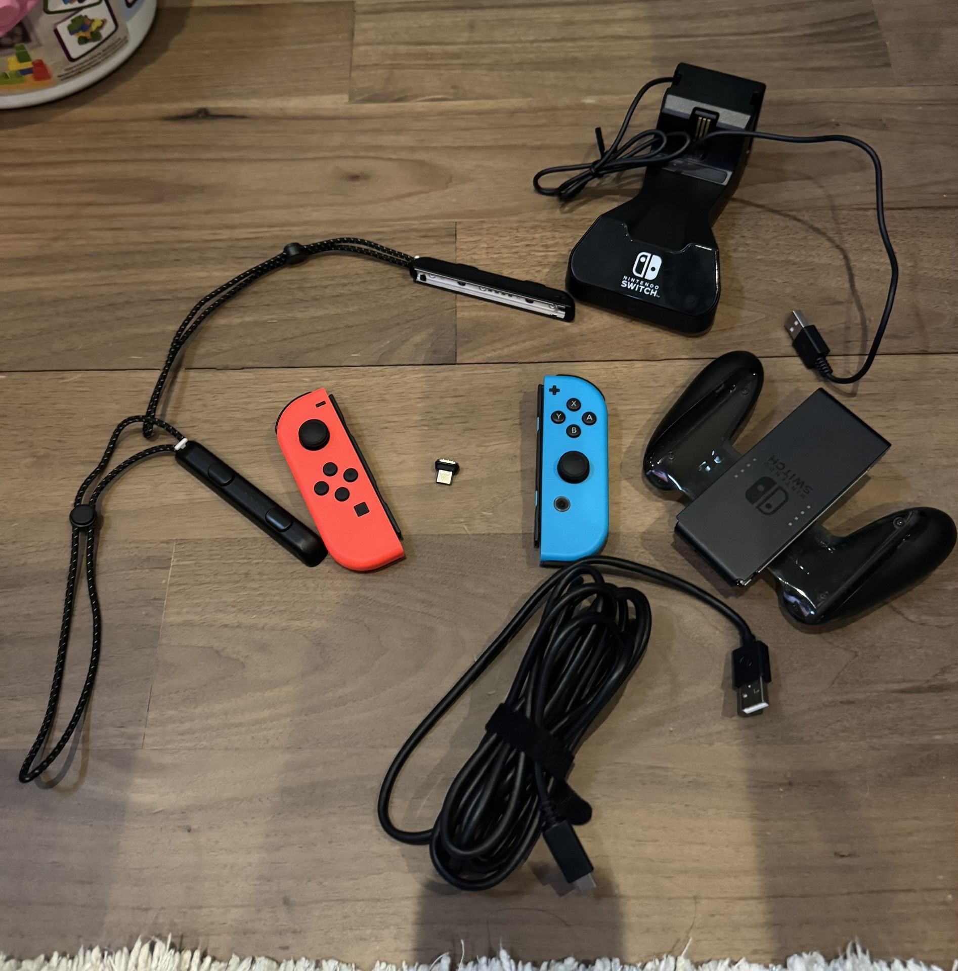 Nintendo Switch Joy Con L/R Neon Red Blue with Charger and Charger Grip