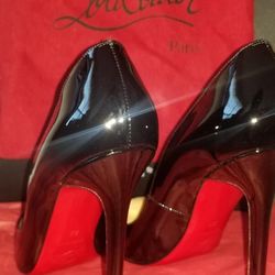Christian Louboutin heels (Black Red Bottoms)