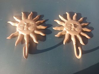 Wrought Iron pair of Sunburst Decrotive hangers.