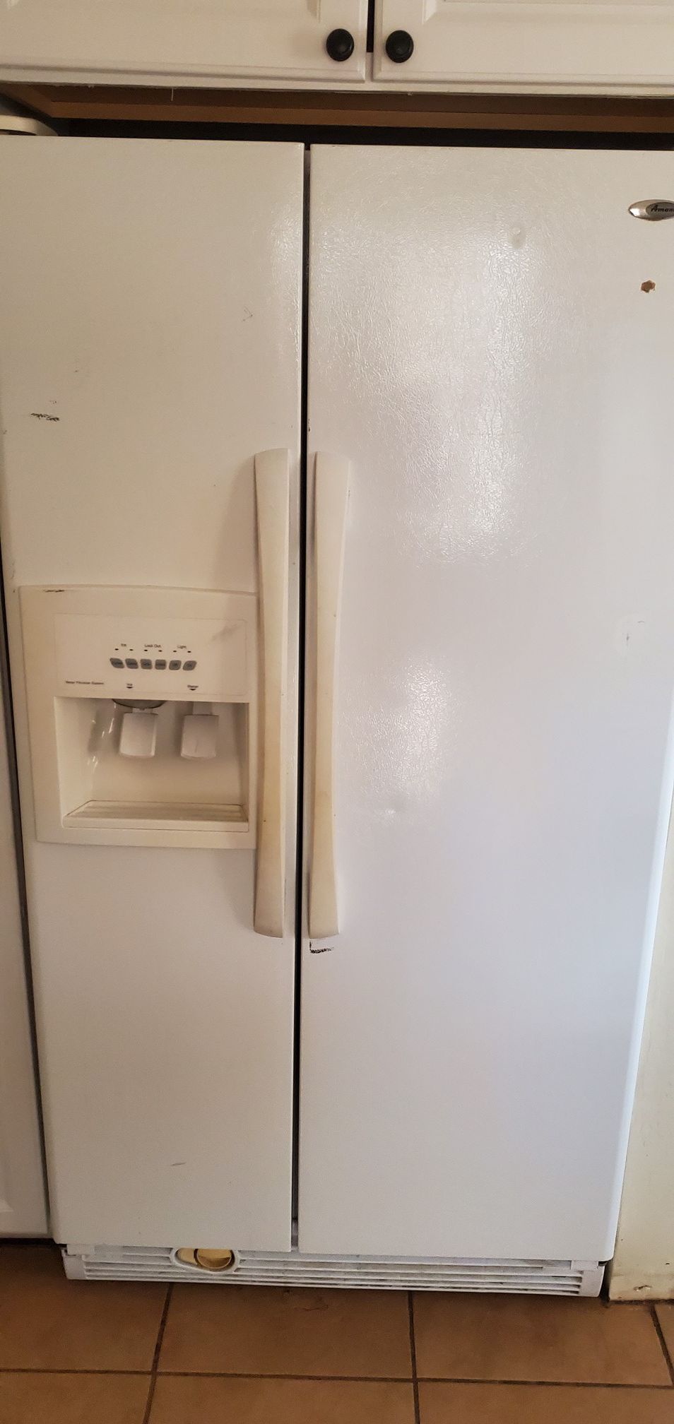 Amana double door refrigerator with ice and water dispenser