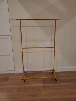 Rolling clothing wardrobe rack