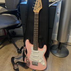 pink SQUIER Fender mini guitar 