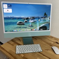 Like New 2023 Apple M3 iMac 24-inch Green with matching color Magic Keyboard and mouse.  