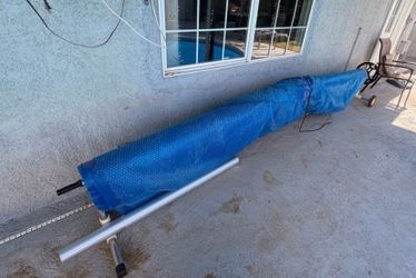 Pool cover with reel